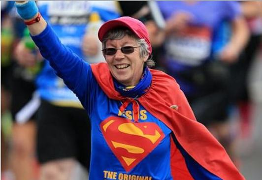 Pam Storey in a Superman costume fundraising at the London Marathon
