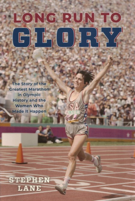 The cover of Long Run to Glory by Stephen Lane showing a picture of Joan Benoit striding across the finish line of the 1984 Los Angeles Olympic Games marathon with her arms aloft.
